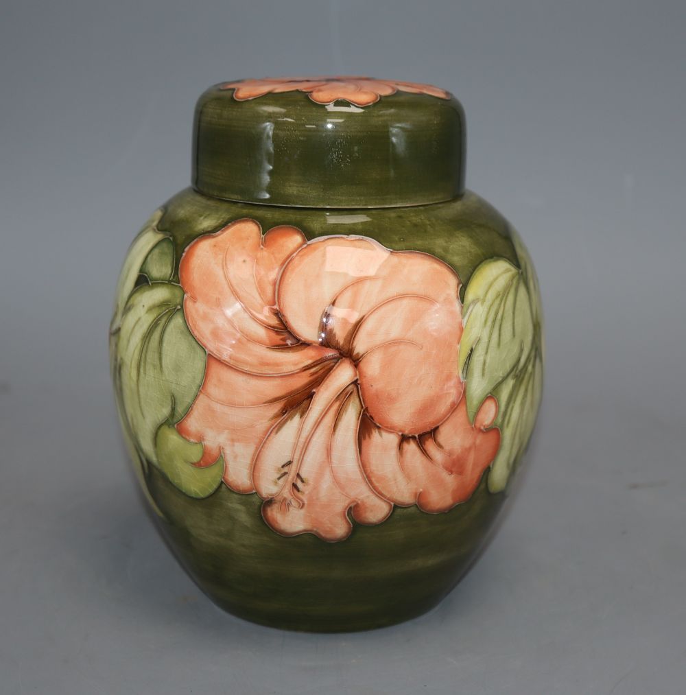 A Moorcroft hibiscus pattern jar and cover, height 20cm